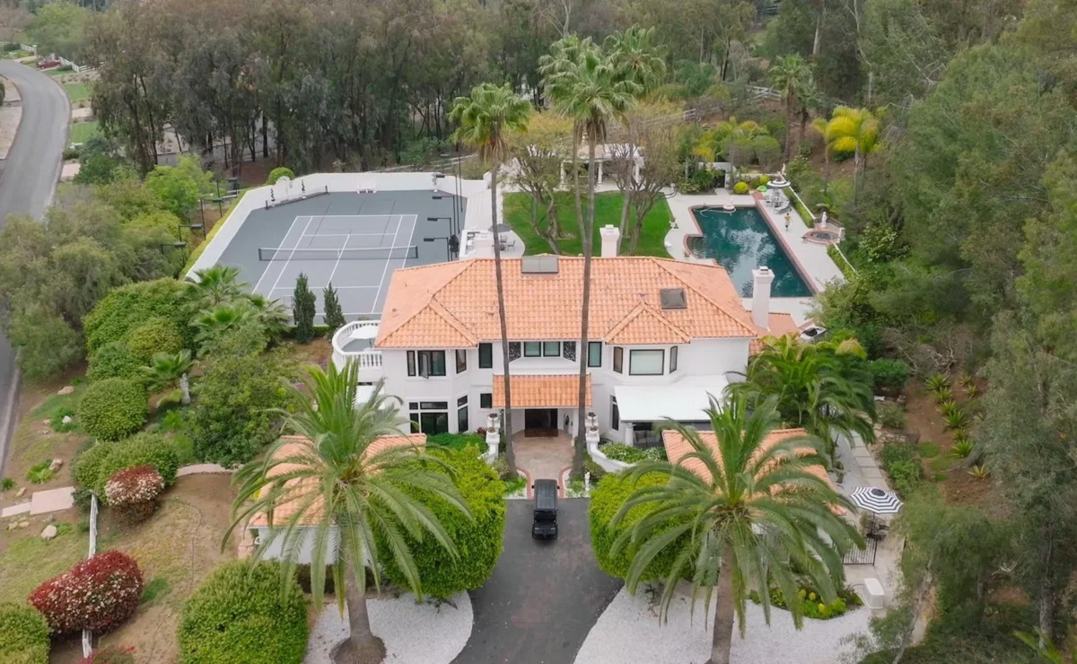 Aerial view of an AToN Center residence with pool, tennis court and gardens in Encinitas