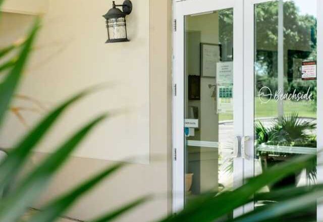 Glass entrance doors at Beachside Rehab in West Palm Beach