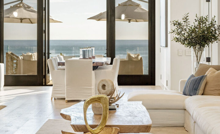 Living and dining area at Carrara’s Malibu Beach House overlooking the ocean