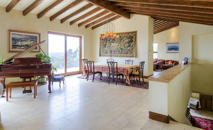 Hillside Laguna residence interior with dining area and ocean view
