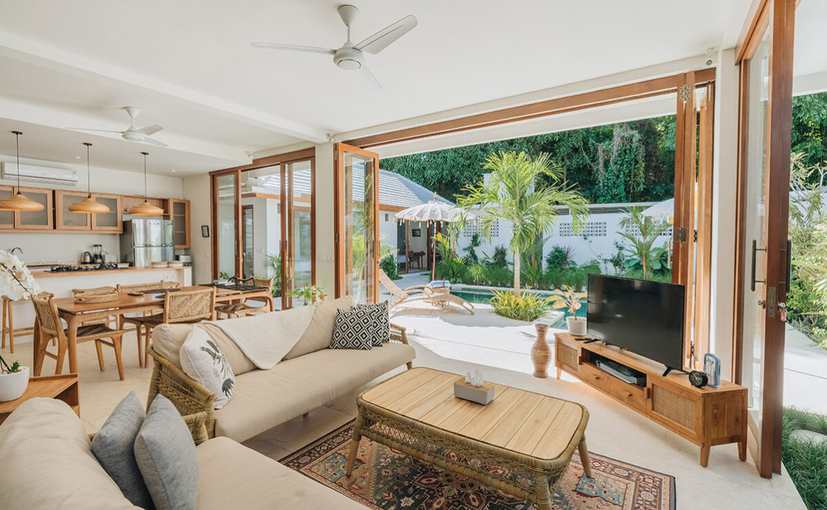 Living and dining area opening to the pool at Lighthouse Bali Villa Marco