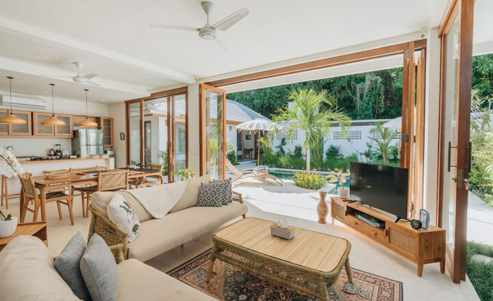 Living and dining area opening to the pool at Lighthouse Bali Villa Marco