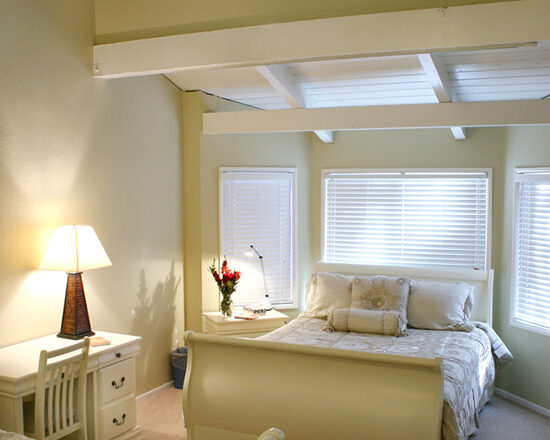 Bedroom with two beds and large windows at Milestones Ranch Malibu