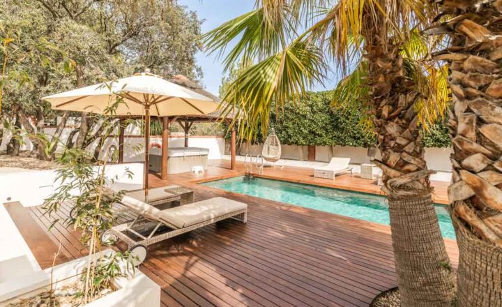 Pool, wooden deck and loungers in Montgó Lifestyle’s garden