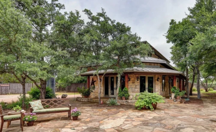 Stone exterior and courtyard at Paradigm Treatment's Austin teen residence