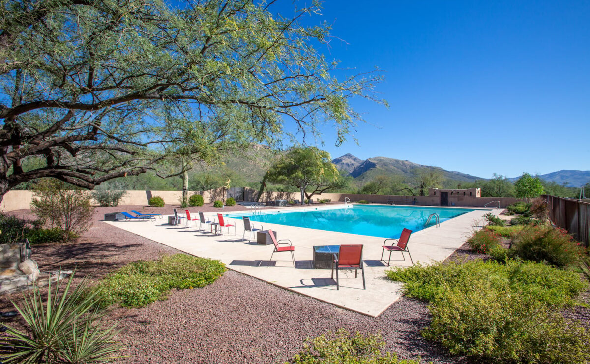 Outdoor swimming pool and desert grounds at Sabino Recovery in Tucson