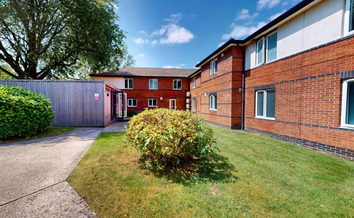 Red-brick exterior and garden at Sanctuary Lodge in Halstead