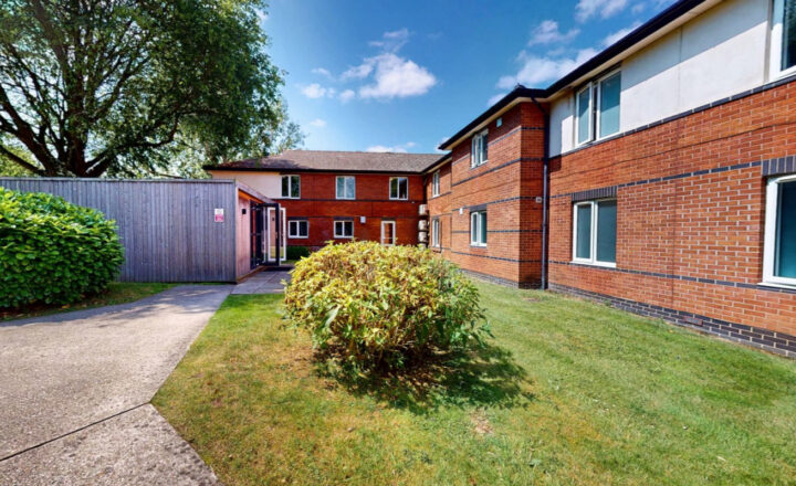Red-brick exterior and garden at Sanctuary Lodge in Halstead