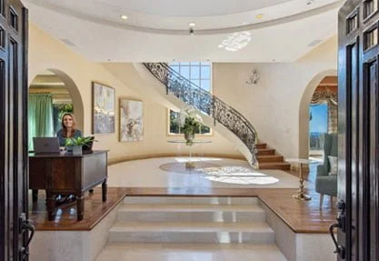 Entrance hall and curved staircase at Seasons in Malibu