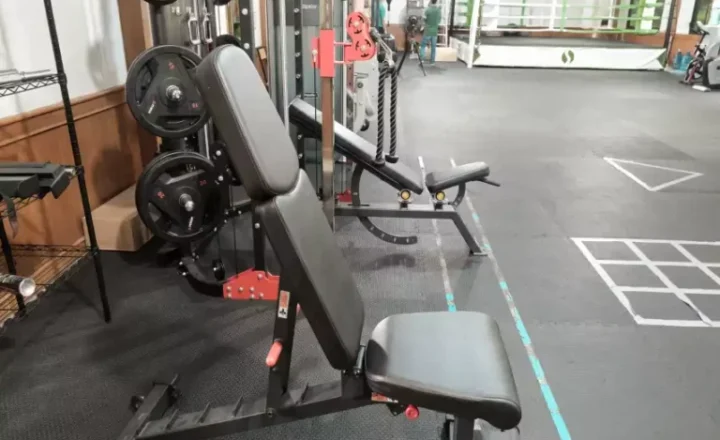 Weights equipment and boxing ring in Siam Rehab's indoor gym