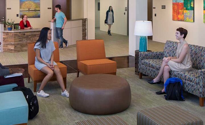 Client lounge with seating and windows at Skyland Trail Rollins Campus
