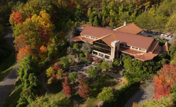 Aerial view of Smoky Mountain Lodge’s residential building and wooded grounds