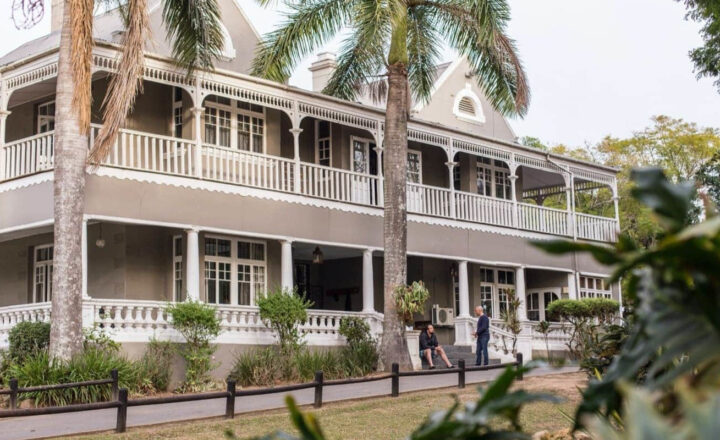 Historic farmhouse exterior at The Cedars South Coast Estate