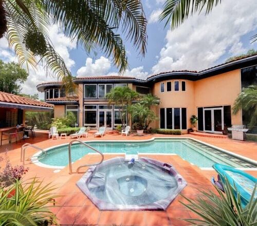 Pool and spa beside the lakeside residence at Tikvah Lake Recovery in Sebring