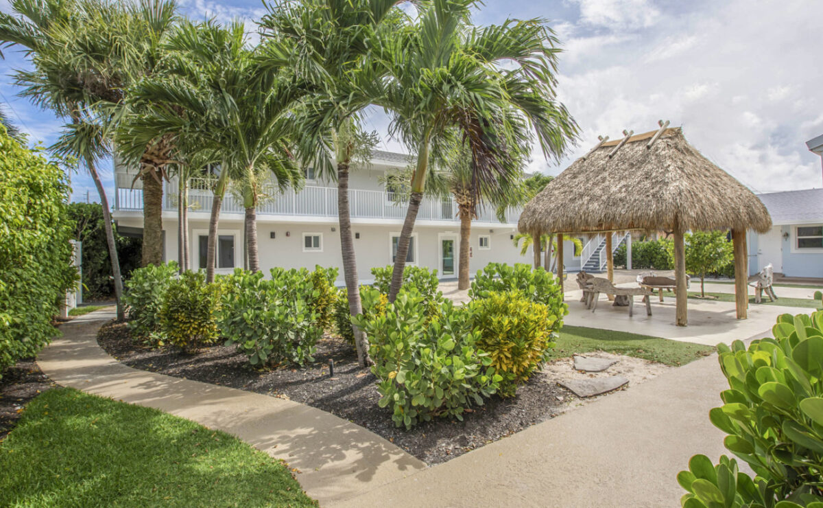 Palm-lined exterior of Zinnia Health Singer Island in Riviera Beach
