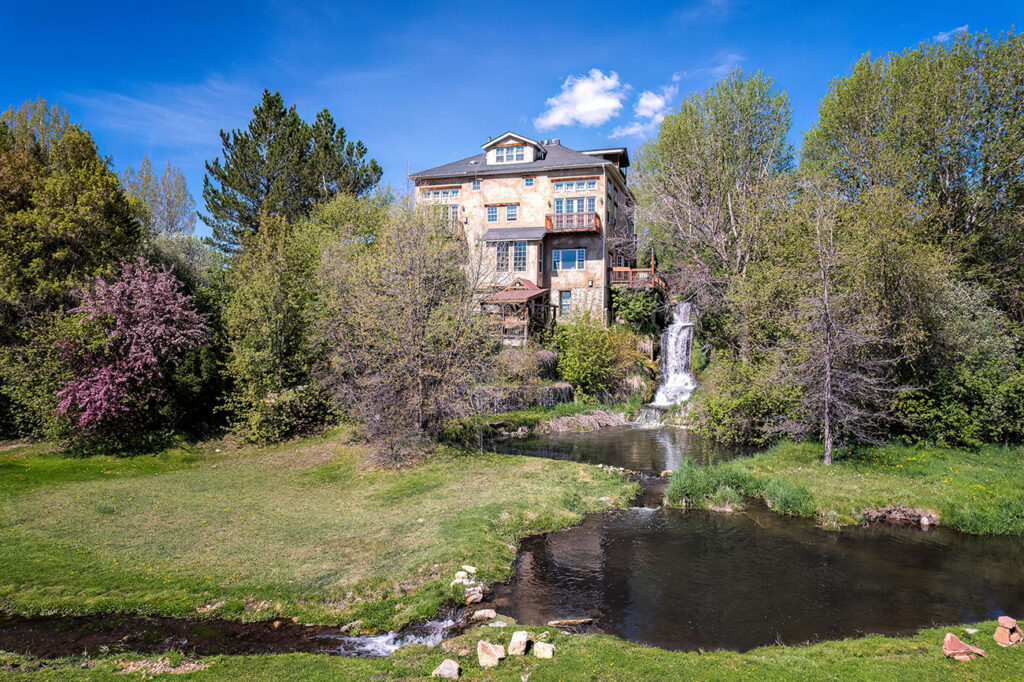 Acqua Recovery's Midway residential building beside its pond