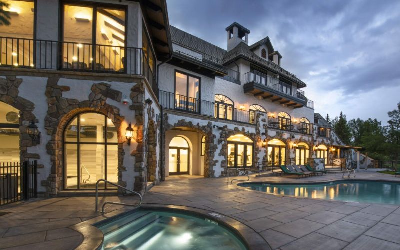 Lodge exterior and pool at All Points North Lodge