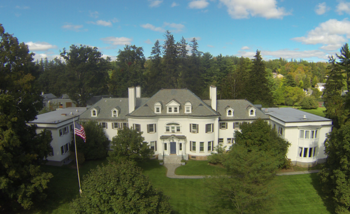 Elevated view of Austen Riggs Center buildings and wooded grounds