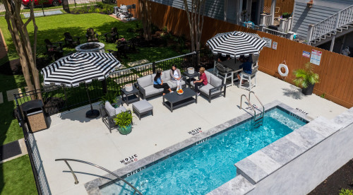 Pool and outdoor seating at Black Horse Health in Houston