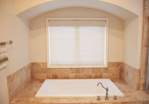 Bathroom with bathtub in Capo by the Sea’s Capo House