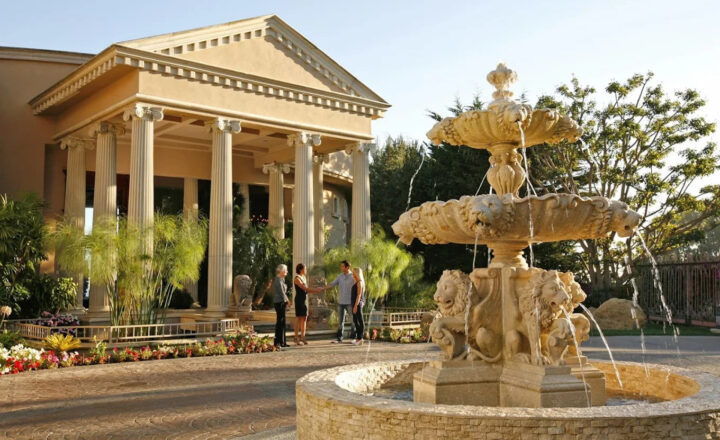 Fountain and columned entrance at Passages Malibu