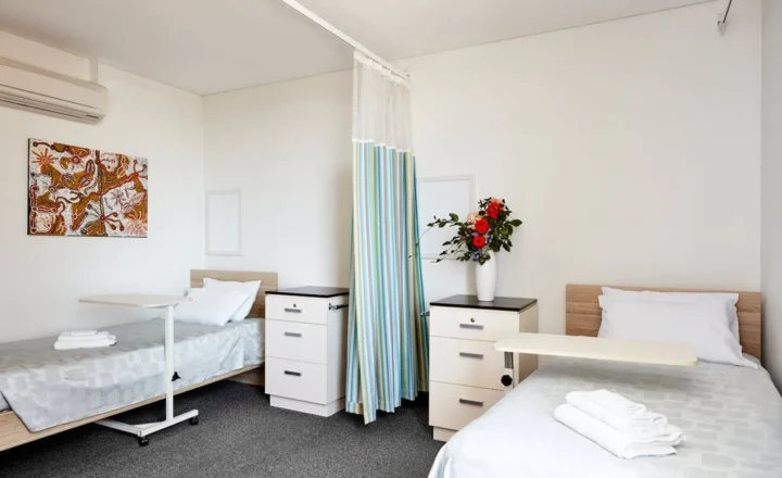 Shared twin bedroom with privacy curtain at South Pacific Private