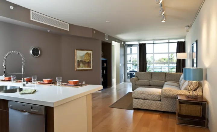Kitchen and living room inside a Betty Ford Center Naples condominium
