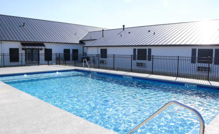 Pool and residential buildings at Infinite Recovery Legacy Ranch in Texas