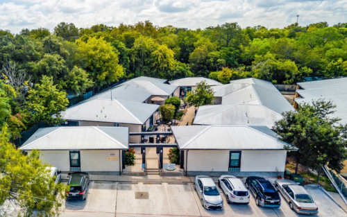 Landscaped courtyard and residential building at New Choices Treatment Center in San Antonio