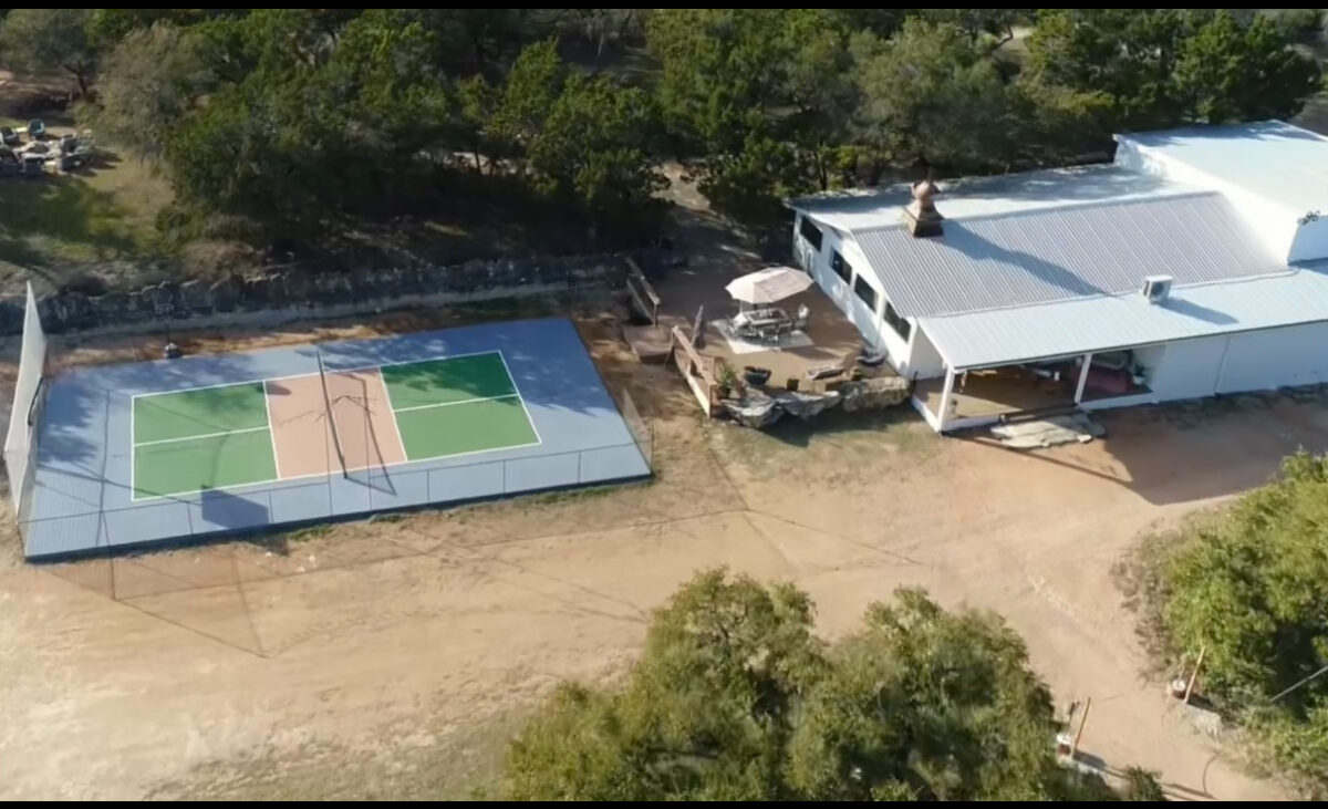 Aerial view of the WITHIN Center residential campus at AWKN Ranch in Austin, Texas