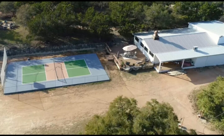 Aerial view of the WITHIN Center residential campus at AWKN Ranch in Austin, Texas