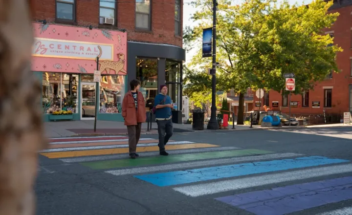 Two people walking through downtown Northampton in Windhorse program photography