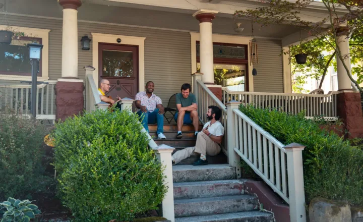 People seated outside a Windhorse Portland community residence